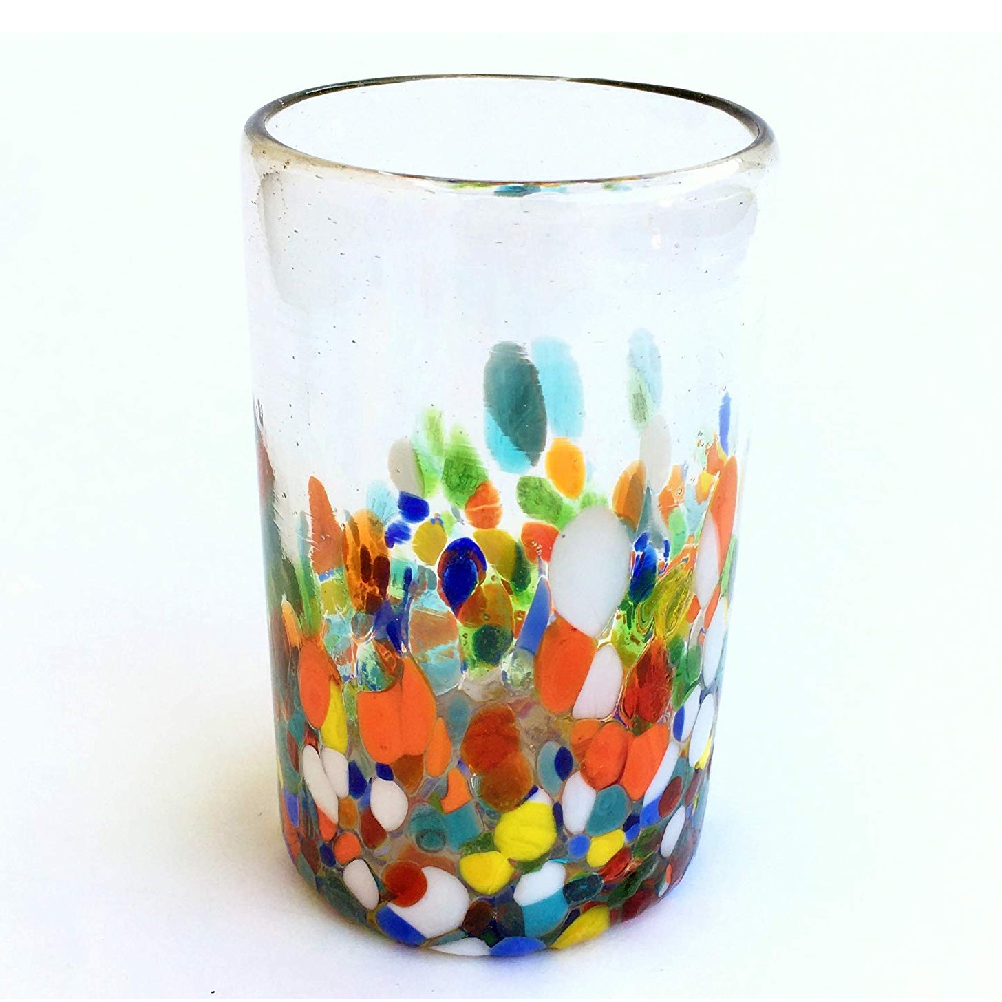 Wholesale Mexican Glasses / Clear & Confetti 14 oz Drinking Glasses  / Our Clear & Confetti drinking glasses combine the best of two worlds: clear, thick, sturdy handcrafted glass on top, meets the colorful, festive, confetti bottom! These glasses will sure be a standout in any table setting or as a fabulous gift for your loved ones. Crafted one by one by skilled artisans in Tonala, Mexico, each glass is different from the next making them unique works of art. You'll be amazed at how they make having a simple glass of water a happier experience. Each glass holds approximately 14 oz of liquid and stands a bit over 5